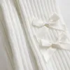 White vertical striped socks with double bow decorations Application Scenario